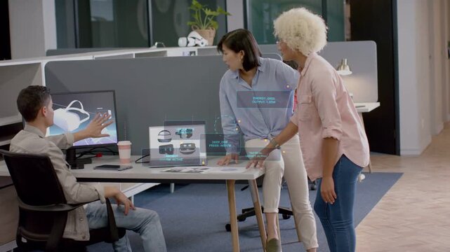 Product team leaning over laptop reviewing product mockup, man pressing key revealing AR thumbnails