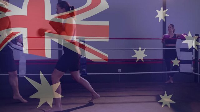 Coach presenting pads, trainee practicing boxing drills in ring under faint Australian flag overlay