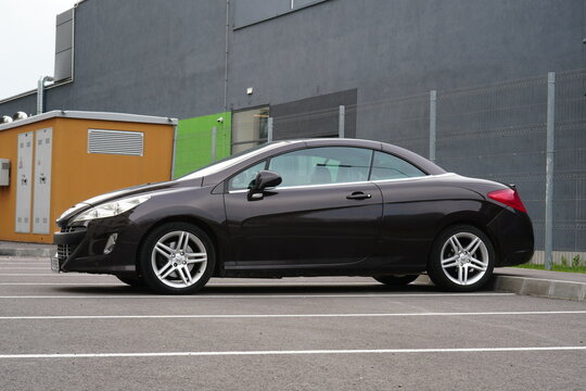 Bucharest, Romania &ndash; April 13, 2026: Side view of Peugeot 308 cc black car on parking lot