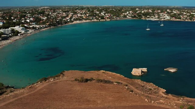 Aerial sky view overlooking Fontana Bianca beach and the surrounding crystal ocean