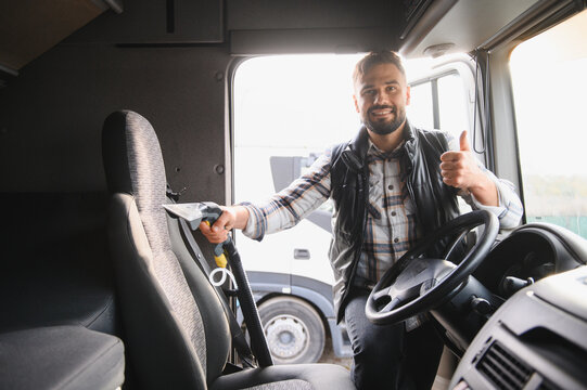 Professional man cleaning truck interior giving thumbs up
