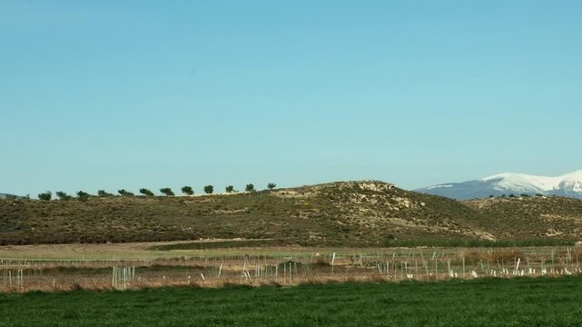 View of Moncayo massif with snow across rural Spain.