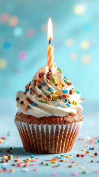 sweet tasty birthday cupcake with candle and confetti vertical video