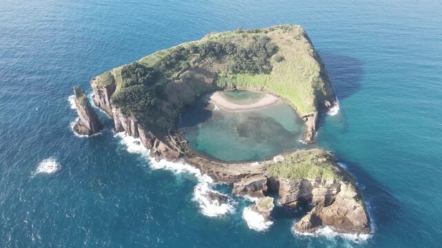 Aerial view of Vila Franca do Campo volcanic islet and crater lagoon, Azores. 4k 60 fps