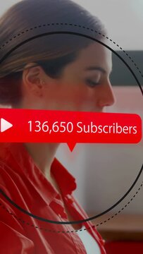 Woman at desk viewing ring passing across face starting sub badge updating to 679,402 for marketing