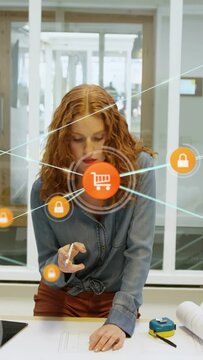 Woman leaning over plans, orange orb appearing, expanding to cart, tapping locks, securing design