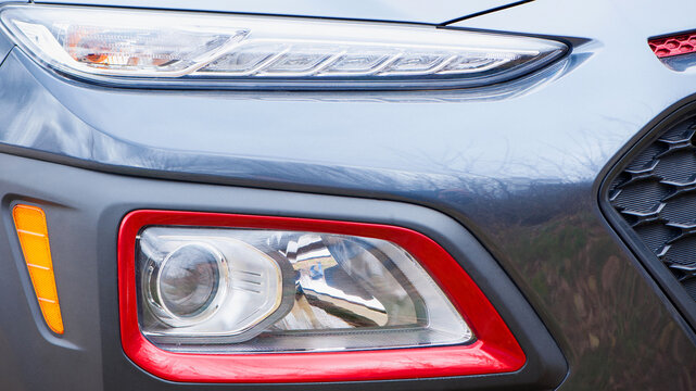 photo headlight of modern prestigious car close-up. beautiful headlights of a car. part of the front, the car is unrecognizable. direction indicators on a sports car