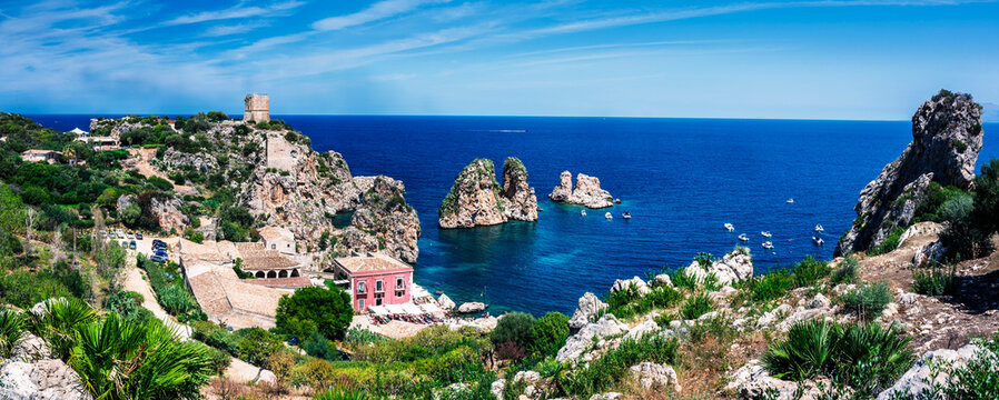 A magical summer holiday in Sicily. The Bay of Scopello, framed by its sea stacks, and the magical gulf of Castellammare del Golfo.