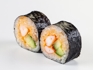 Closeup of two maki sushi rolls with shrimp and cucumber filling isolated on white. © Andrei Starostin
