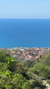 Coastal village of Agnone Cilento with blue sea and hillside landscape, Mediterranean Italy 4K