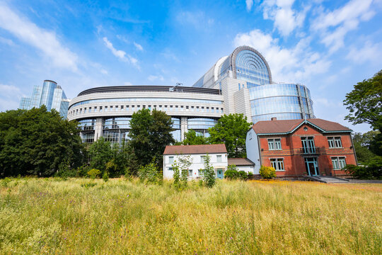 European Parliament building and old houses in Brussels city, Belgium