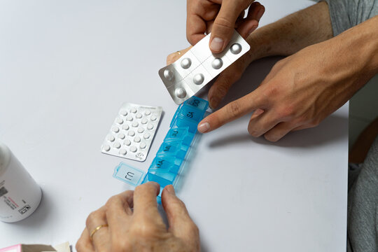 Organizing Weekly Medication with a Pill Organizer and Blister Packs
