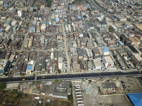 Aerial view of the urban sprawl where buildings and roads create a dense network of human activity, Oworonshoki, Lagos, Nigeria.