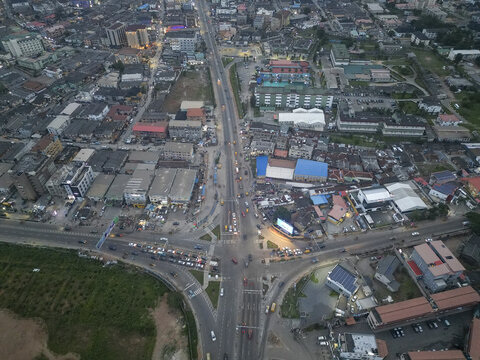 Aerial view of roads converging and buildings densely packed together, showcasing the urban sprawl of Ikeja, Lagos, Nigeria.
