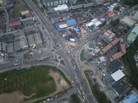 Aerial view of the bustling Allen Avenue intersection, where cars and buildings create a tapestry of urban life, Ikeja, Lagos, Nigeria.