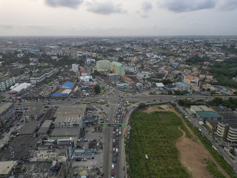 Aerial view of traffic congestion on Allen Avenue, a bustling commercial hub, contrasting with the surrounding buildings, Ikeja, Lagos, Nigeria.