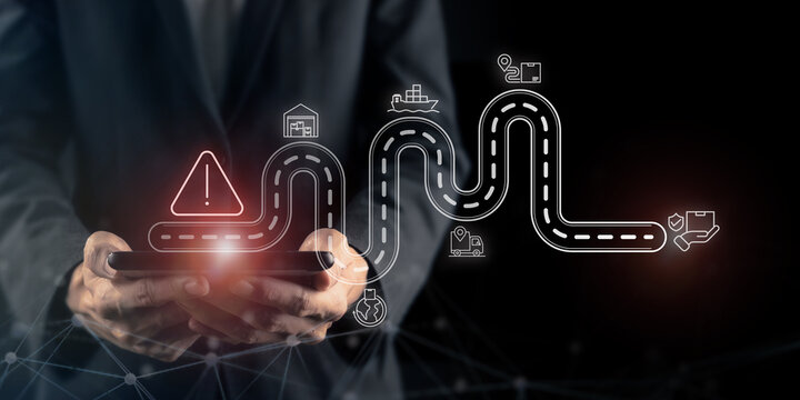 Supply chain risk management and geopolitical crisis. Using tablet with digital supply chain route and warning icon. Logistics risk management and geopolitical crisis affecting global trade networks.