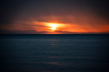 Fototapeta premium A magical summer holiday in Sicily. Cefalù, and its ancient town at sunset.