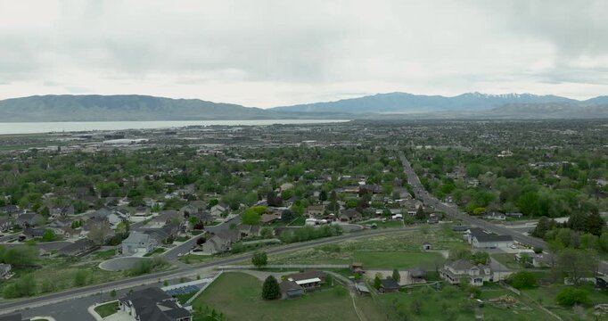 Pleasant Grove in Utah County, United States within local valley showing residential grid descending toward the lake and western mountains along basin margin, ancestral lands of the Ute people aerial