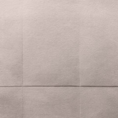 Fototapeta premium Textured beige fabric background with copy space