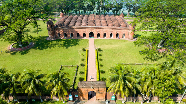 Aerial view of the Sixty Dome Mosque, a historic landmark with its terracotta facade and multiple domes, standing majestically amidst the verdant landscape, Bagerhat, Khulna Division, Bangladesh.