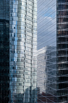 Modern corporate towers and skyscraper glass facade with reflection in urban architecture cityscape for ambitious business branding background