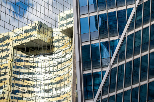 Abstract modern corporate architecture structure where glass facade reflection becomes a geometric pattern for a sleek conceptual background