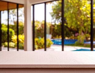 Obraz premium Modern Home Interior Overlooking Lush Green Backyard Pool.