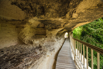 Wooden walkway inside cliff cave chambers at Aladzha Monastery Bulgaria