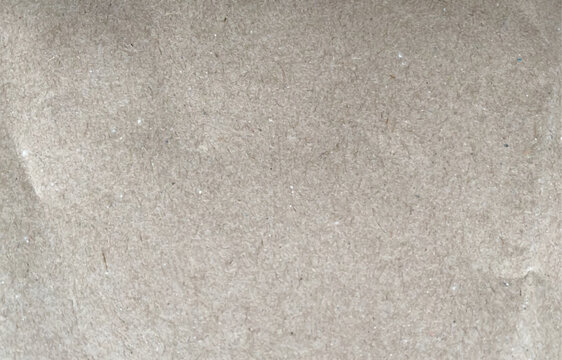 Craft paper texture. Realistic cardboard background. Horizontal slightly crumpled textured empty craft paper or cardboard sheet. Vector.