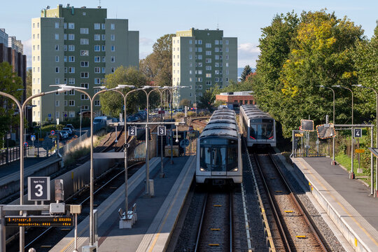 Front view of metro arrival at Brynseng platform in Oslo Norway with rail transport and commuter focus under crisp clear daylight today