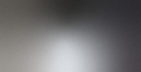 Minimal gradient backdrop for hero image design with noise grain texture and soft light blur in grey black tones © Emre Akkoyun
