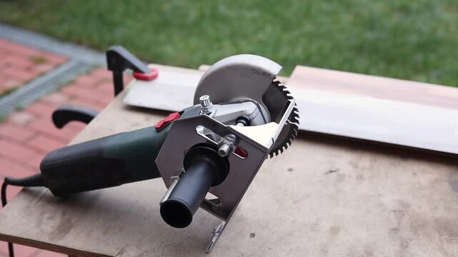Circular saw positioned on a workbench with metal profile ready to cut, DIY construction tools outdoors, home workshop setup.