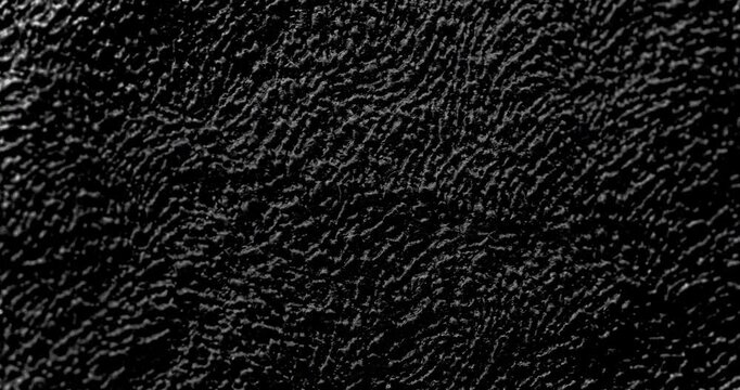 Abstract black rough texture. Slow Diagonal Panning.