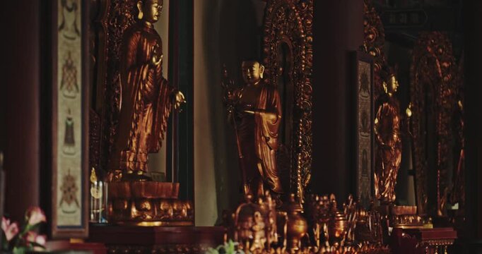 Golden Buddhist statue inside Yonghe Lama Temple