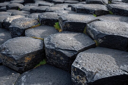 Close-up view of hexagonal basalt columns, forming a natural, geometric, and textured landscape