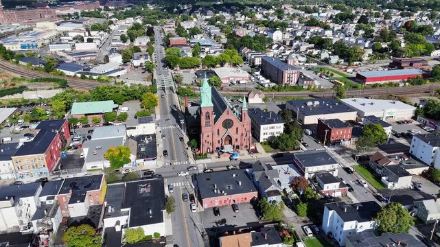 Distant drone obit around the gothic revival Saint Patrick Parish church, Lawrence, Massachusetts, USA
