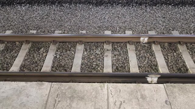 Railway track detail with gravel and concrete sleepers