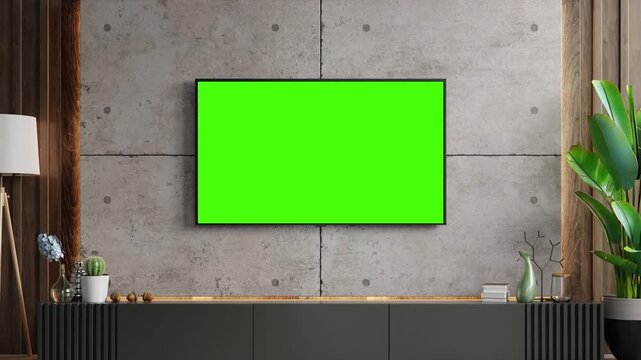 An empty interior gallery features a blank wooden picture frame on a white wall above a vintage table and green grass