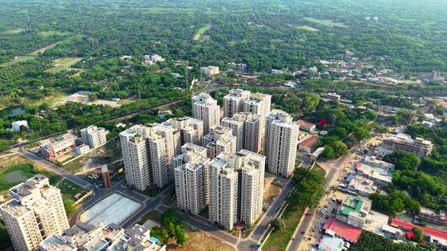 Modern high-rise residential complex in a sprawling urban landscape.