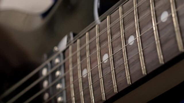 Playing electric guitar fretboard closeup. High quality 4k footage
