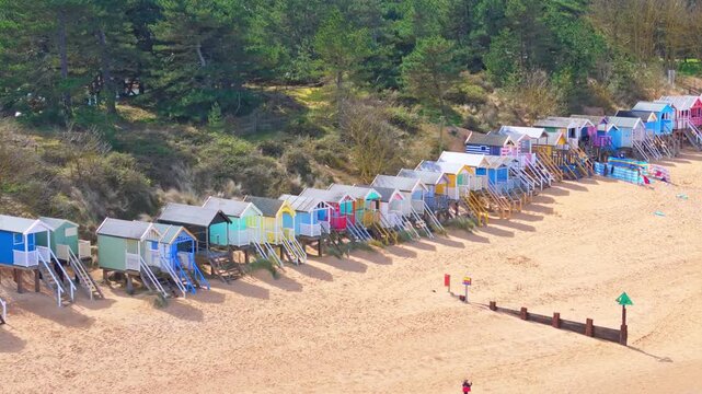 Wells Next to the Sea Beach. Sand dunes where Norfolk Coast path with beach huts and tourist beaches. Beach huts on the promenade at Gorleston-on-sea in Norfolk, UK.