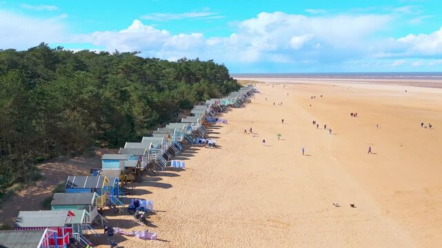 Wells Next to the Sea Beach. Sand dunes where Norfolk Coast path with beach huts and tourist beaches. Beach huts on the promenade at Gorleston-on-sea in Norfolk, UK.