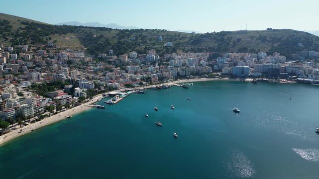 Saranda Albania Aerial Drone 4K &ndash; Coastal City Panorama with Beach, Bay and Yachts, Waterfront Architecture on Ionian Sea, Europe Travel Destination