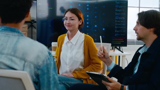 Diverse creative team of programmer develop ai assistant project together.Software engineer brainstorm about brain android robot,coding language,designer,artificial virtual intelligence with big data