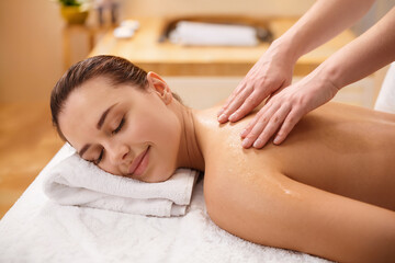 Fototapeta premium Relaxation through soothing massage in a tranquil spa environment