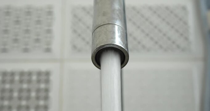 close up of flowing tap water with blurred background