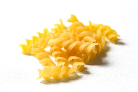 fusilli pasta isolated on white background