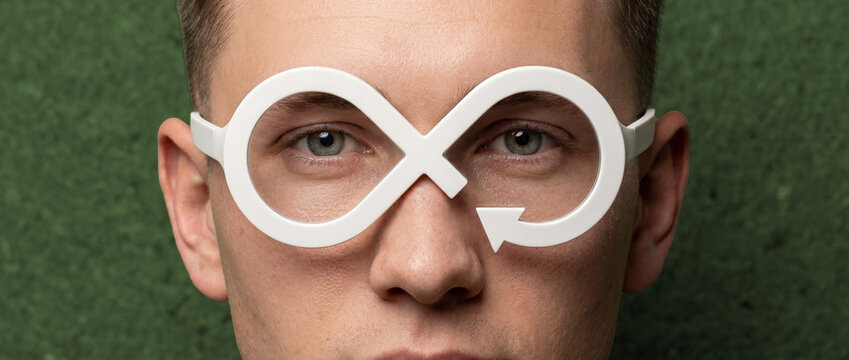 Sustainable future vision concept: Man and circular economy infinity symbol eyewear