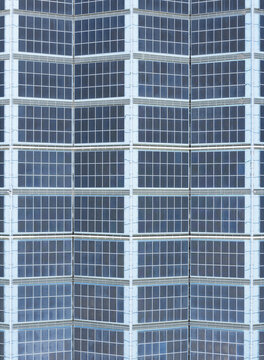 Aerial view of solar panels on the factory roof arranged in a geometric grid pattern for renewable energy production in Taiwan.
